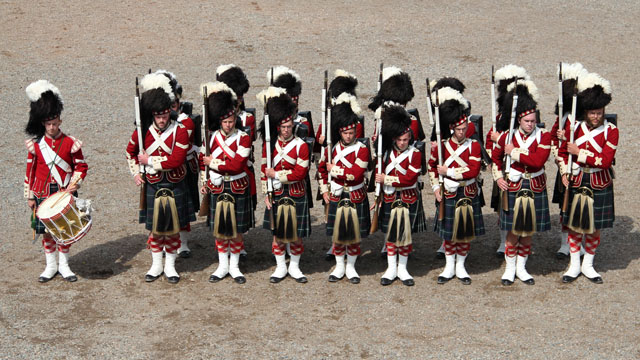 Highlanders stand in formation on the Parade Square.