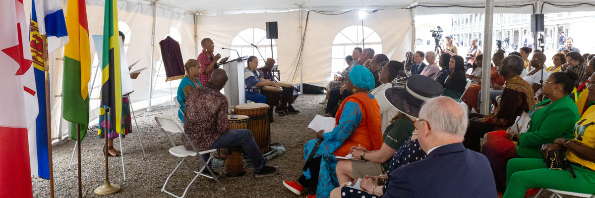Drummers perform for a full audience in a tent at Halifax Citadel National Historic Site.