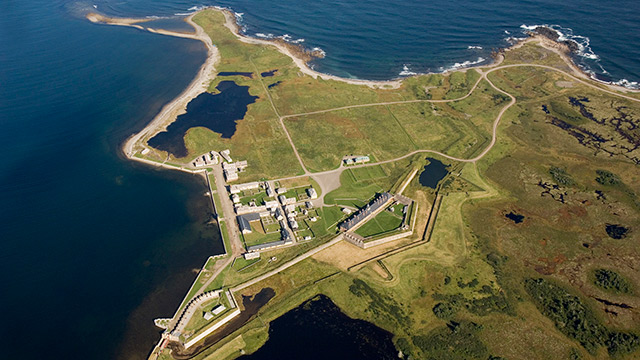 A vertical aerial view of the reconstructed Fortress of Louisbourg beside the Atlantic Ocean