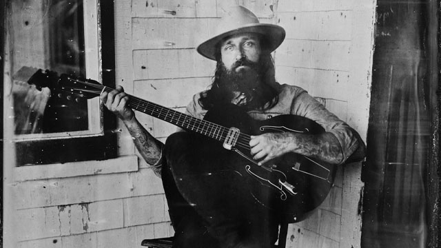 A man with a guitar.
