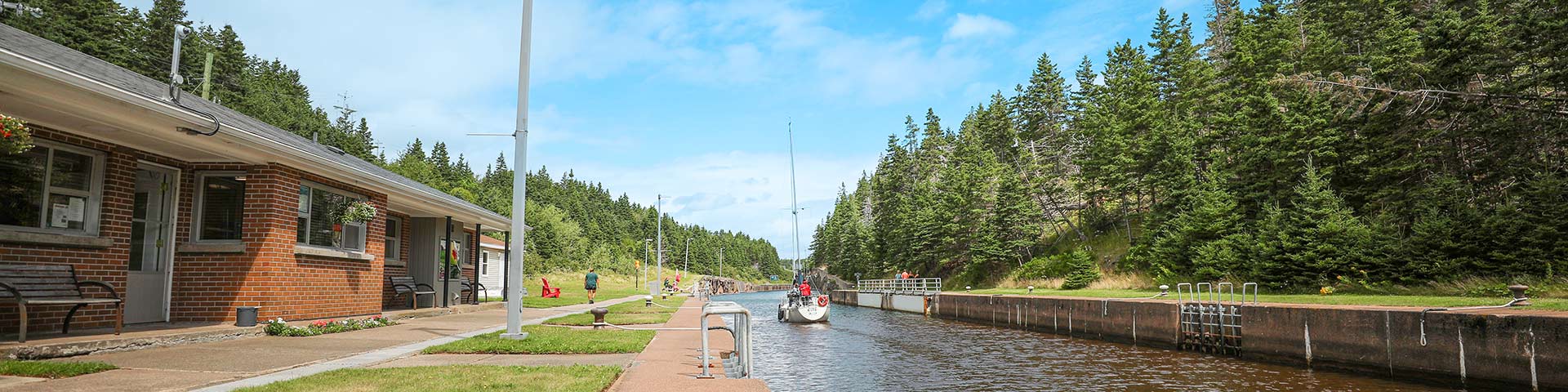 A sailboat passes through St. Peters Canal