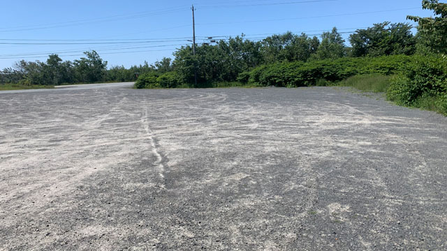 A small gravel parking lot.
