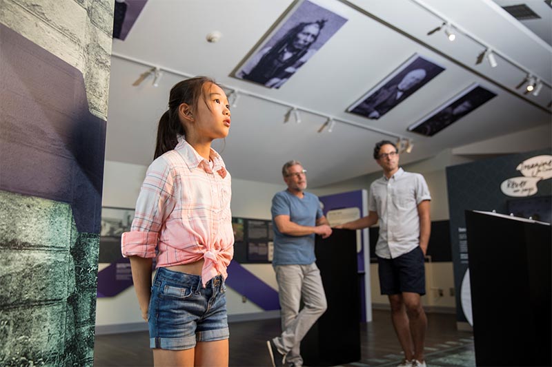 A family takes in the many stories of Confederation. Bellevue House National Historic Site.