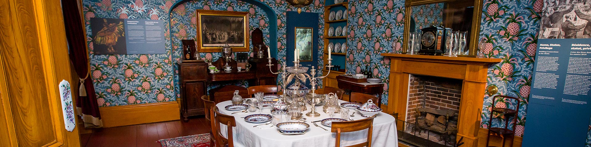 A historic dining room set for dinner. 