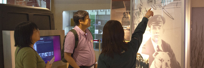 Park staff take two visitors on a private tour through the site. 