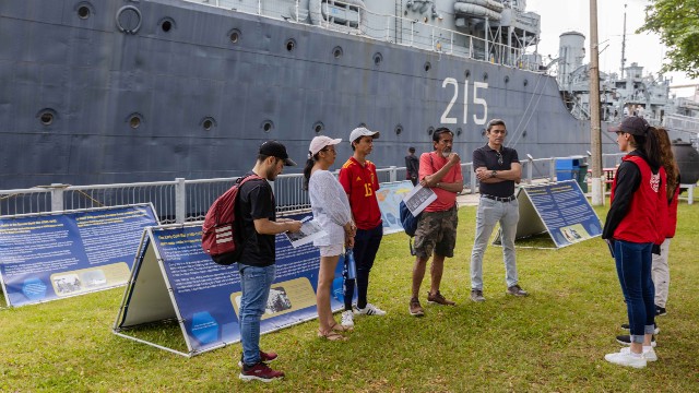 Visitors getting a tour from Spanish Language volunteers at the jetty.