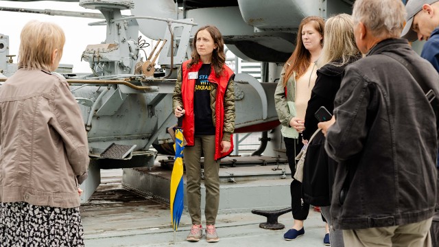 Visitors getting a tour from Ukrainian Language volunteers at the jetty.