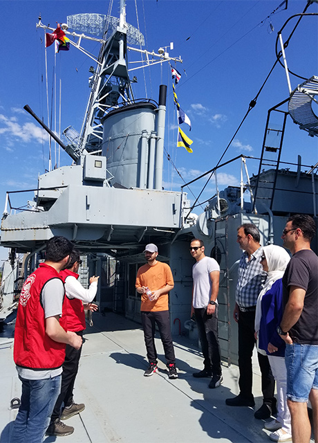 visitors get a guided tour from Arabic Language Day volunteers abord HMCS Haida