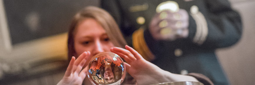 A women looking in to a glass ball