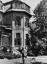 W.L. Mackenzie King and and his dog Pat outside Laurier House 1939