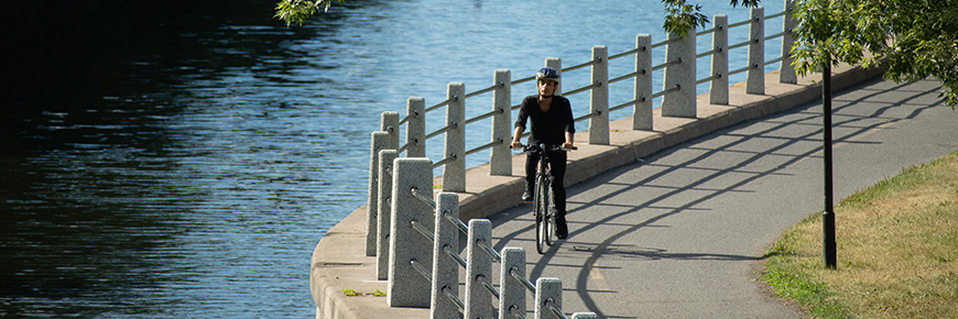 A cyclist makes his way along the Rideau Canal trail in Ottawa.