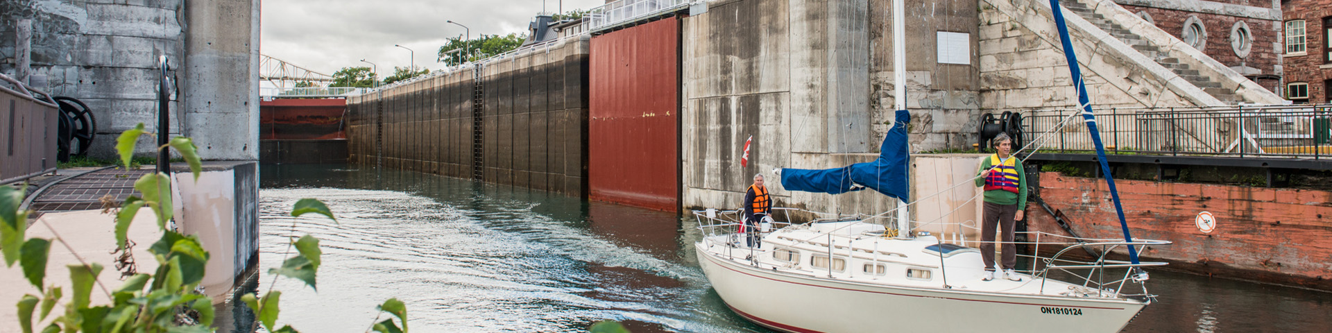 A sailboat leaving the lock.