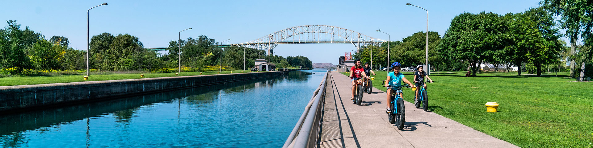 A family biking beside the canal. 