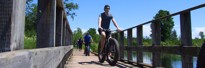 A man on a bike.