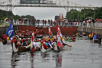 100 paddlers locking through the Sault Canal lock on Canada Day 2017
