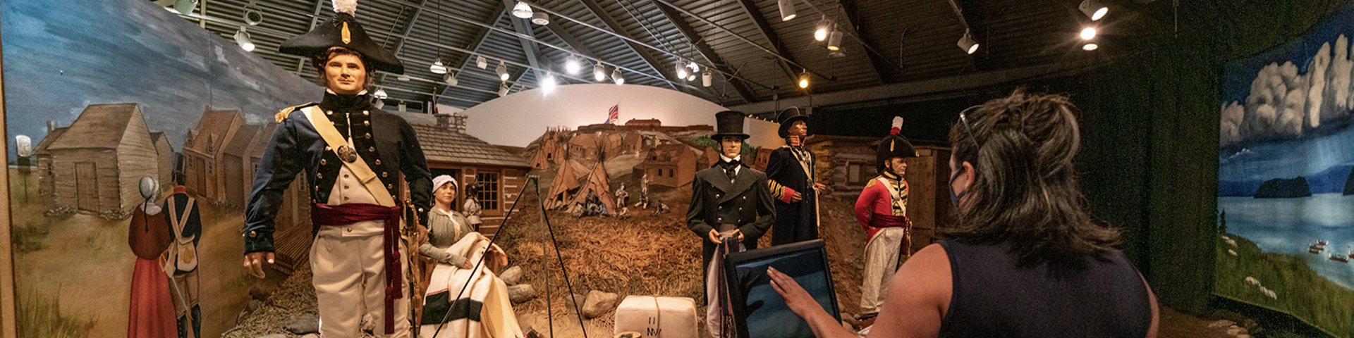 A visitor viewing an exhibit in the museum. 