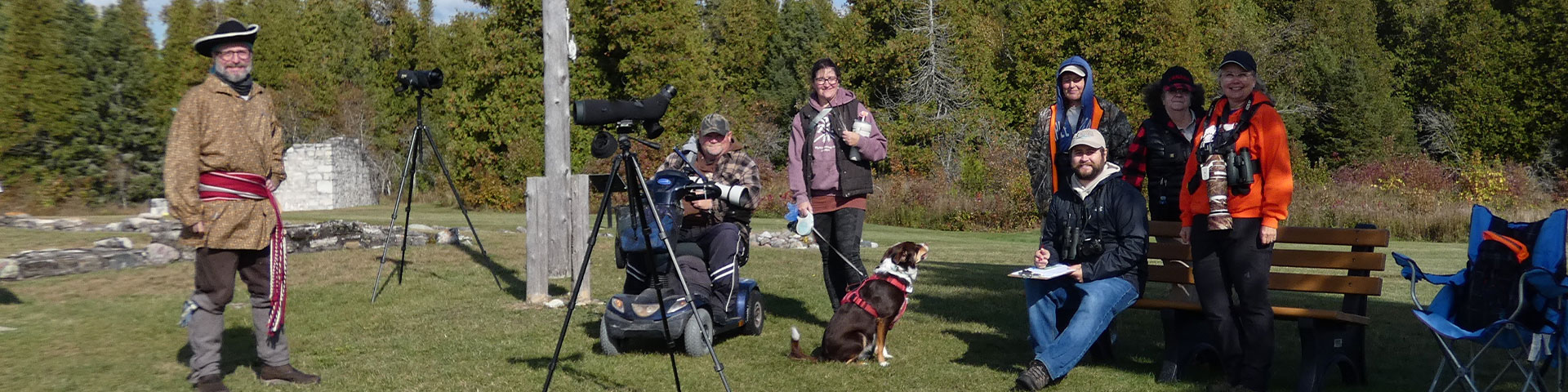 Volunteer with bird watchers. 