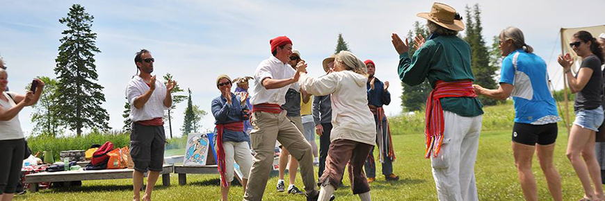 A group of people folk dancing