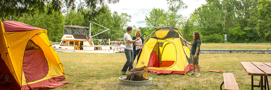 a tent outside a lockstation alongside the canal