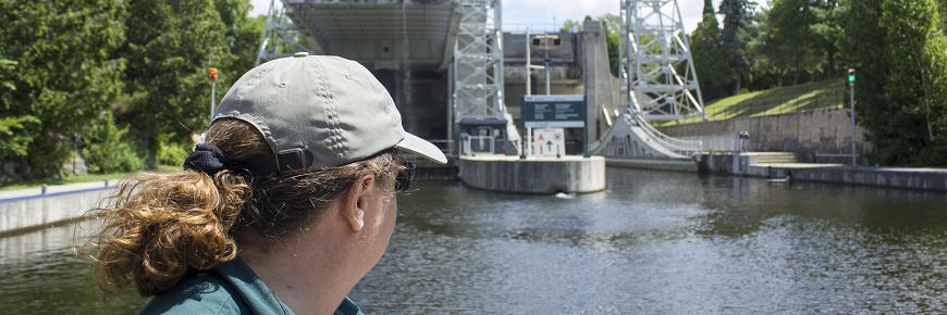 Parks Canada student on the water in front of Kirkfield lift lock