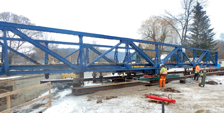 Glen Ross Swing Bridge is moved onto sliding rails to shift the bridge into its on-site resting place for rehabilitation over the next few months.