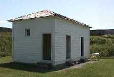 The Latrine. Please click on the photo to see reproductions of artifacts found during an excavation.