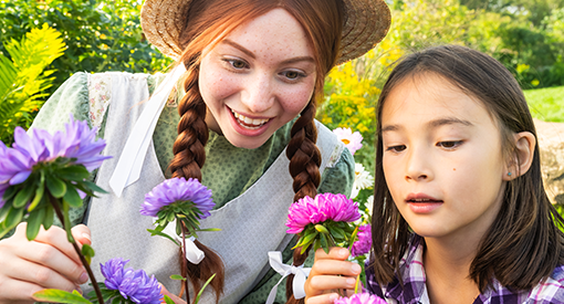 Anne shows a young girl pink and purple flowers
