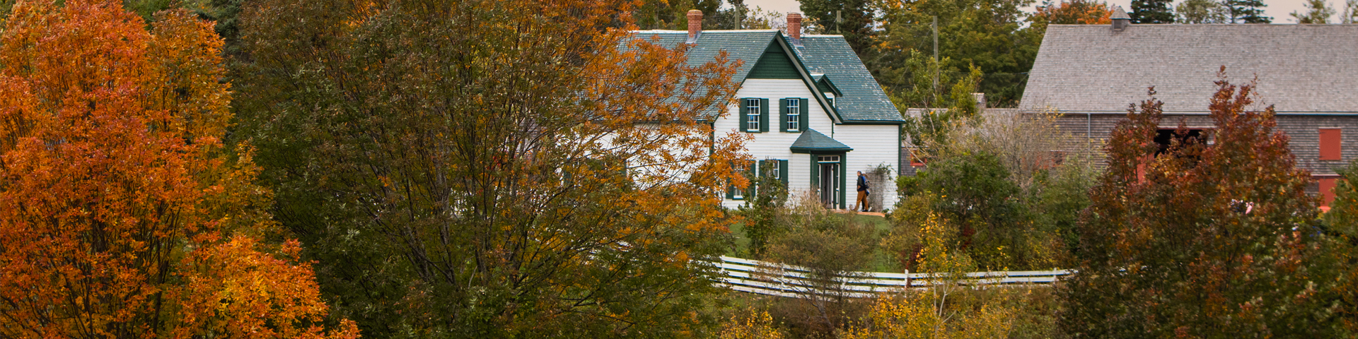 Green Gables house sits nestled among fall coloured trees