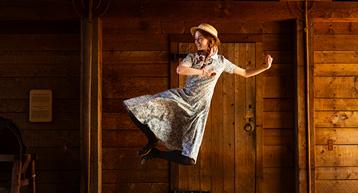 Anne leaps for joy in the barn at Green Gables