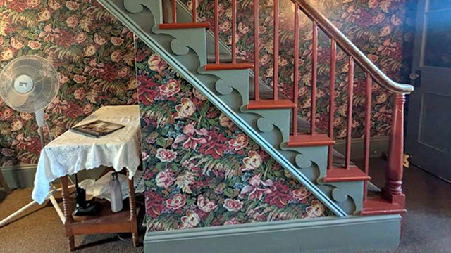 The stairs are steep to the second floor of Green Gables House.