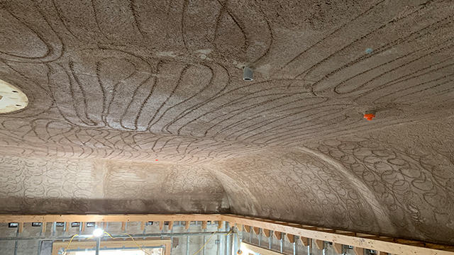 tall arched ceilings with second coat of plaster with swirls