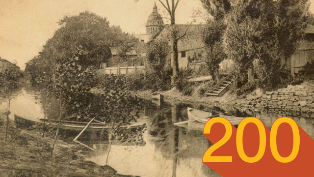 The canal, between 9th and 10th av. in Lachine, July 1915. Mr. Michael Fleming in a rowboat.
