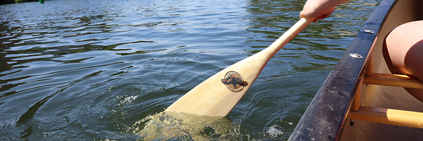 Canoe and paddle on the water