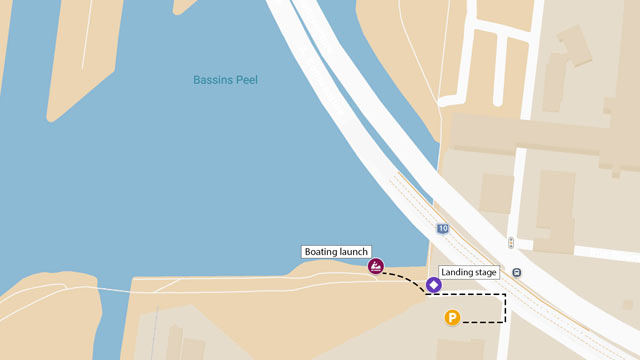 Illustrated map guiding visitors from the parking area to the non‑motorized watercraft launch docks.