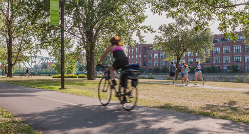 Cyclist on the Lachine Canal track, Charlevoix Station area