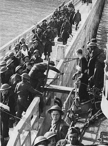 Black and white picture of soldiers on a small bridge