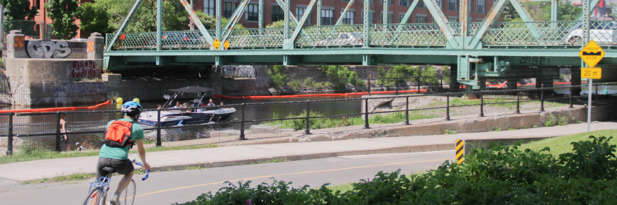 Cyclist on the Lachine Canal bike path in Montreal