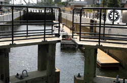 Photography showing a few boats moored at the lock