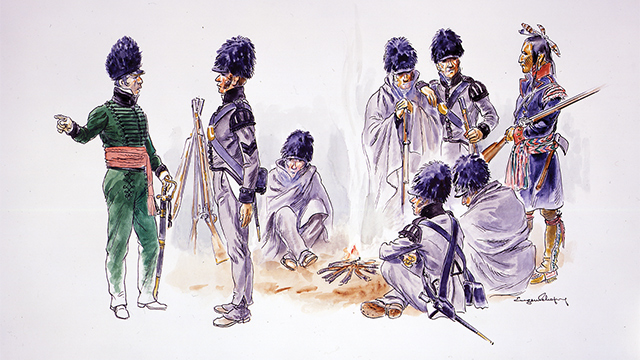 Des soldats se réchauffent autour d'un feu avec un éclaireur autochtone