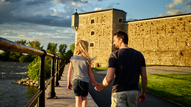 A young boy observes the Richelieu River outside Fort Chambly National Historic Site.