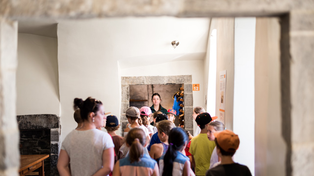  A group of students following a Parks Canada guide in the Dauphine redoubt.