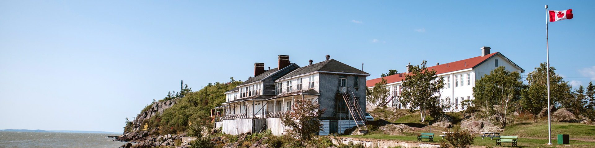 View of 2nd and 3rd class hotels and the Celtic cross from the wharf at Grosse-Île.