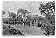 Black and white picture of the door, the bridge, the ditch and the natural environment around Fort Lennox.