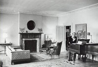 Eric D. McLean is sitting at his piano