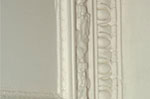 Plaster cornice at the ceiling of the living room.