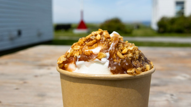 Caramel sundae on a picnic table. 