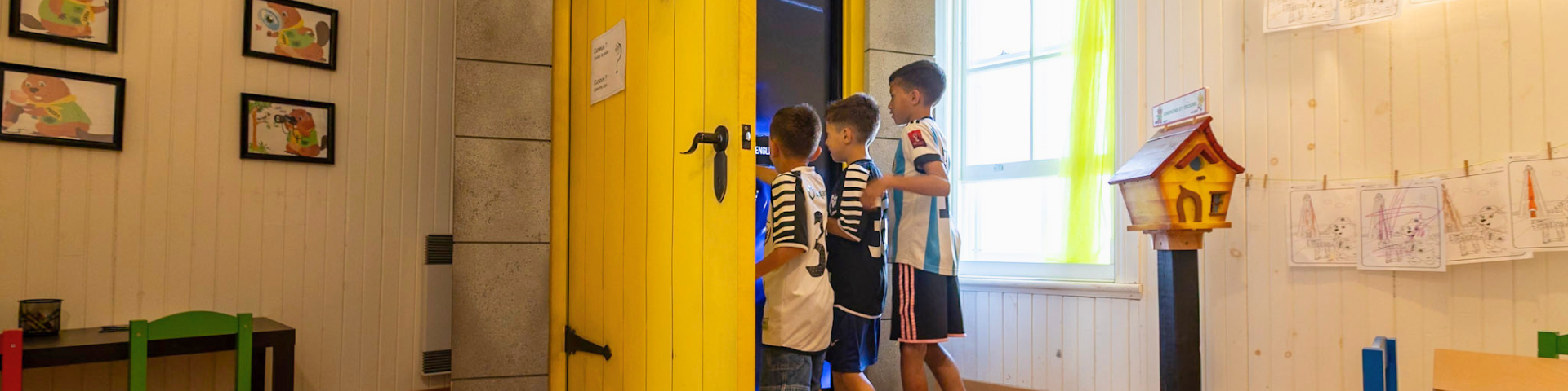 Children explore the virtual portal in the engineer’s house.