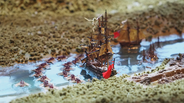 Detail of a model of a naval battle.