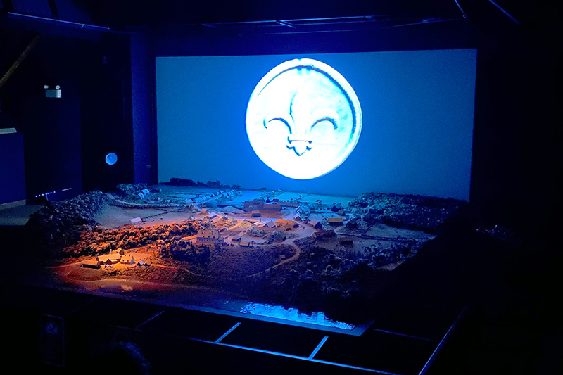 View of the illuminated model during the multimedia presentation, A Story Cast in Iron, at the Forges du Saint-Maurice National Historic Site.