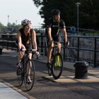 A couple cycling at the Saint-Ours Canal lock